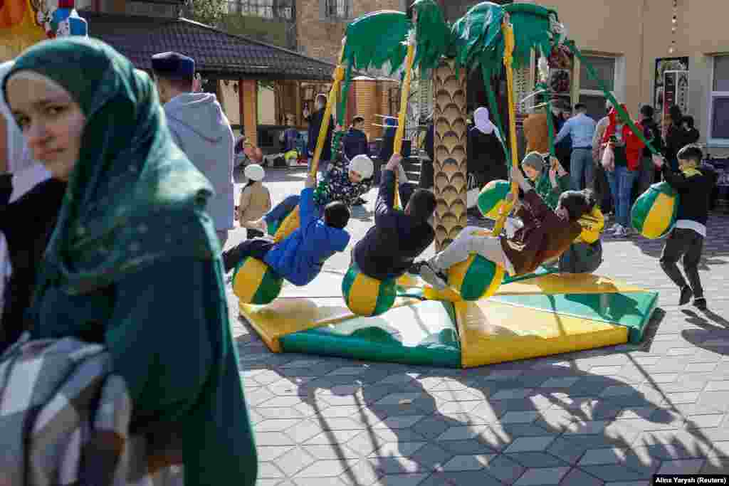 Muslim faithful celebrate Eid al-Fitr at the Islamic Cultural Center in Kyiv.