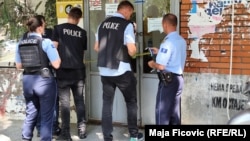Kosovar police raid a Post of Serbia branch in Zvecan, part of wider actions near the Serb border.
