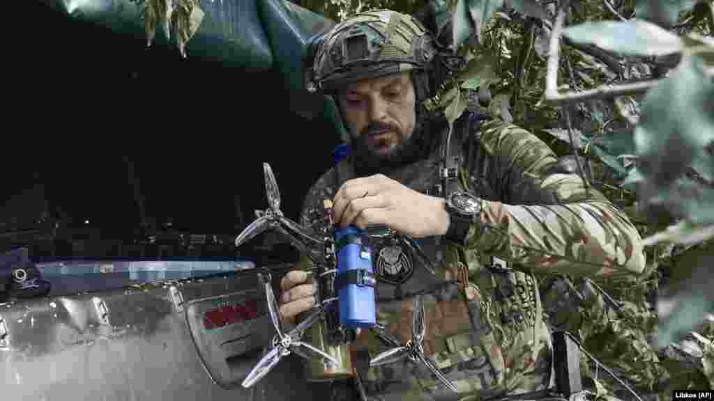 A Ukrainian soldier prepares a drone near the front in the&nbsp;Zaporizhzhya region on July 1. Both sides have increased their use of drones in combat operations. &nbsp;