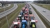 A drone view of farmers' tractors blocking a speedway from Lublin to Warsaw as they protest against the European Union's Green Deal and imports of Ukrainian agricultural products, on the outskirts of Warsaw in Wiazowna, Poland, on March 6.