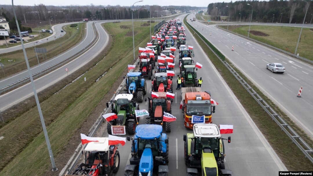 A drone view of farmers' tractors blocking a speedway from Lublin to Warsaw as they protest against the European Union's Green Deal and imports of Ukrainian agricultural products, on the outskirts of Warsaw in Wiazowna, Poland, on March 6.