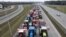 A drone view of farmers' tractors blocking a speedway from Lublin to Warsaw as they protest against the European Union's Green Deal and imports of Ukrainian agricultural products, on the outskirts of Warsaw in Wiazowna, Poland, on March 6.