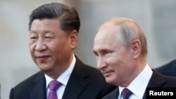 Chinese President Xi Jinping (left) and Russian President Vladimir Putin (file photo)