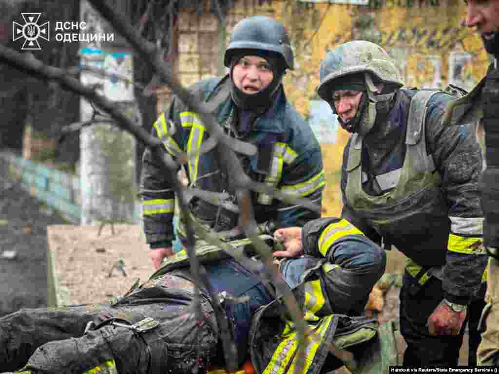 A State Emergency Service photographer captured these images of first responders who had arrived at the site of a Russian missile strike in the southern Ukrainian city of Odesa who were themselves struck by a second missile. A paramedic and an emergency service worker were among the at least 19 people killed during the March 15 attack, officials said.