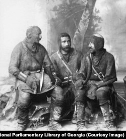 A studio portrait shows Georgian men dressed in chain mail.