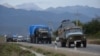 Cars of refugees from Nagorno-Karabakh pass through the Armenian village of Kornidzor late last month. 