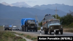 Cars of refugees from Nagorno-Karabakh pass through the Armenian village of Kornidzor late last month. 