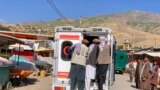 Relatives accompany the bodies of slain victims in an ambulance after an explosion at the Nabawi mosque in the Hesa-e-Awal area of Fayzabad district, Badakhshan Province, on June 8.
