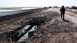 UKRAINE – Chonhar bridge, which connects the Russian-occupied Ukrainian Crimea with mainland Ukraine, damaged by shelling, June 23, 2023. The photo was taken a day after the shelling
