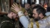 Ukrainian soldiers receive a blessing during Christmas Eve mass on December 24 near the city of Kupyansk in the Kharkiv region.<br />
<br />
Kyiv is defying Moscow as it celebrates Christmas for the first time on December 25 instead of on January 7, the day observed by the Russian Orthodox Church.&nbsp;