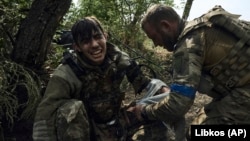 Despite Taking Casualties, Ukraine's Bloodied Troops Fight On Near Bakhmut
