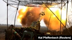 A Ukrainian artillerist fires toward the front line during heavy fighting near the eastern city of Bakhmut on April 13. 