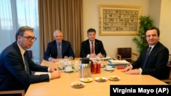 Serbian President Aleksandar Vucic (left) and Kosovo Prime Minister Albin Kurti (right) meet with European Union foreign policy chief Josep Borrell (second left) in Brussels on February 27.