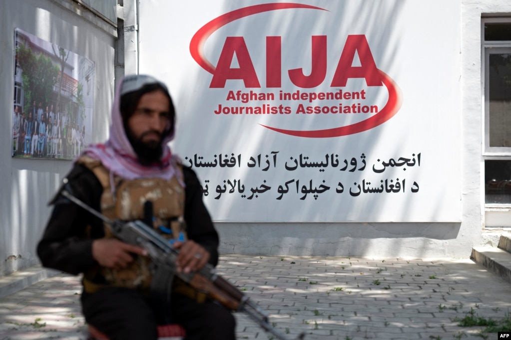 A member of the Taliban security forces keeps a vigil during an event at the office of the Afghan Independent Journalists Association in Kabul on May 3, 2023.