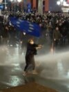 Nana Malashkhia waving a flag of European Union on demonstrations in Tbilsi Georgia