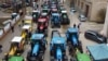 Polish farmers block a street during a protest in Szczecin on April 3 against what they call a flood of Ukrainian grain on the local market, which they say has depressed domestic grain prices. 