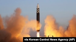 This photo provided by the North Korean government shows what it says is an intercontinental ballistic missile in a launching drill at the Sunan international airport in Pyongyang on March 16, 2023.