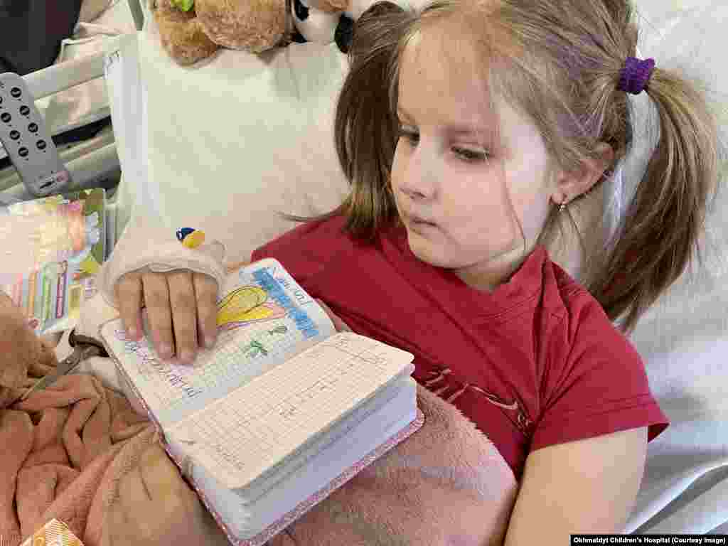 Milana was six when a missile hit her family&rsquo;s house close to Hostomel, near Kyiv, killing her mother in front of her on February 28, 2022. Shrapnel from the strike badly wounded Milana&rsquo;s feet and legs. In her hospital bed between operations she drew pictures and wrote messages to &ldquo;my mom in the sky,&rdquo; such as the one seen above.