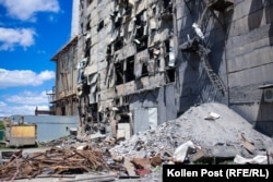 Piles of rubble lie outside one of the plant's shattered walls.