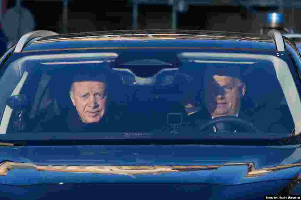  Hungarian Prime Minister Viktor Orban (right) drives a car with Turkish President Recep Tayyip Erdogan in Budapest. &nbsp; 