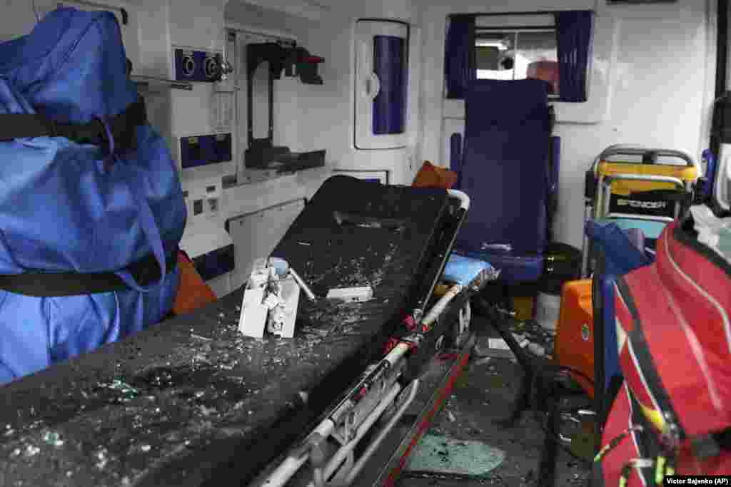 The interior of a damaged ambulance strewn with debris following the missile attack.