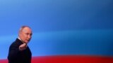 Russian President Vladimir Putin speaks in Moscow after polling stations closed. Putin -- who is now set to surpass Soviet dictator Josef Stalin’s nearly 30-year reign -- said the election showed that the nation was "one team."