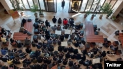 Students hold a sit-in in protest at a university in Iran. 