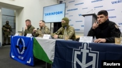 Representatives of the Free Russia Legion, the Siberian Battalion, and the Russian Volunteer Corps attend a press conference of pro-Ukrainian Russian paramilitary groups in Kyiv in March.