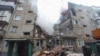 Разрушенный ударом российского дрона жилой дом в городе Сумы, 13 марта 2024 года