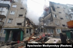 An apartment building is heavily damaged by a Russian drone strike in Sumy, Ukraine, on March 13.