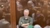 Russian nationalist Kremlin critic and former military commander Igor Girkin, also known as Igor Strelkov, who was charged with inciting extremist activity, sits in a glass defendants' cage during a court hearing in Moscow on July 21, 2023.