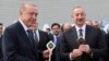 Turkish President Recep Tayyip Erdogan (left) and Azerbaijani President Ilham Aliyev attend an opening ceremony of the new international airport in Zangilan, Azerbaijan, on October 20, 2022.