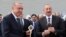 Turkish President Recep Tayyip Erdogan (left) and Azerbaijani President Ilham Aliyev attend an opening ceremony of the new international airport in Zangilan, Azerbaijan, on October 20, 2022.