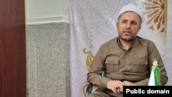 Mohammad Khezrnejad, a Kurdish cleric in Iran, had his death sentence commuted to prison time.