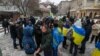 People gathered at the monument to Ukrainian poet Taras Shevchenko in Almaty as a sign of support for Ukraine on the second anniversary of Russia's full-scale invasion on February 24. 