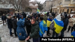 People gathered at the monument to Ukrainian poet Taras Shevchenko in Almaty as a sign of support for Ukraine on the second anniversary of Russia's full-scale invasion on February 24. 