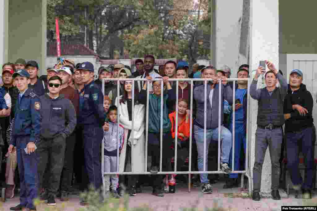 Fans who were unable to get inside crowded the gates and thronged the sidelines of the outside track to catch a glimpse.