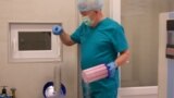 Stefan Khmil takes frozen embryos out of a liquid nitrogen tank at his fertility clinic in Lviv.