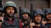 Police officers hold their weapons during a training session at the Elite Police Training Center in Nowshera, Pakistan, on February 10.<br />
<br />
Islamist militant groups such as the Tehrik-e-Taliban Pakistan (TTP), commonly known as the Pakistani Taliban, are increasingly targeting Pakistani police as part of their violent campaign against the Islamabad government.