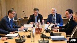 Serbia, President Aleksandar Vucic (left) and Kosovar Prime Minister Albin Kurti (second right) meet in Brussels for talks mediated by EU High Representative Josep Borrell (center right) on May 2.