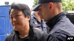 Do Kwon is escorted to court in Podgorica on May 11, 2023.