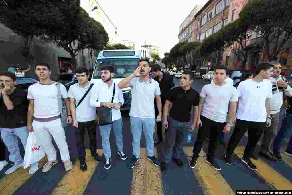 Protesters block a road near the government building in Yerevan on September 19. Angered by what they saw as Moscow&#39;s failure to stop Azerbaijan, demonstrators also gathered outside the Russian Embassy in Yerevan, chanting anti-Russian slogans, TASS reported. &nbsp;