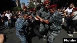 Armenia - Riot police arrest an anti-government protester in Yerevan, September 22, 2023.