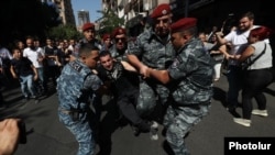 Armenia - Riot police arrest an anti-government protester in Yerevan, September 22, 2023.