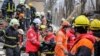 Rescuers remove the body of a local resident from an apartment building in Odesa that was heavily damaged by a Russian drone strike on March 2. 