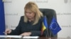 Moldova's central bank Governor Anca Dragu signs the application to join the Single Euro Payments Area in Chisinau on January 30.