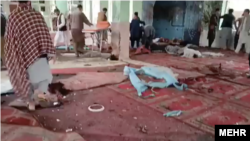 A screen grab from an amateur video that captured the aftermath of a blast in a mosque in Pol-e-Khomri in Afghanistan's Baghlan Province on October 13.