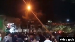 Video of the confessions contains blurred images of two men, along with footage of protests in the city of Mashhad (shown above).