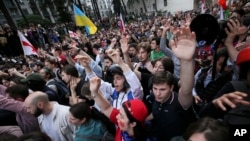 Demonstrators shout at police during an opposition protest against the "foreign agent" law in Tbilisi on May 28.