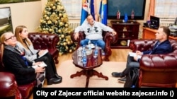 Aleksandr Studenikin (right) meets with the mayor of Zajecar on November 23.